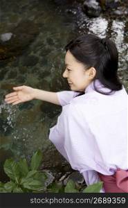 Smiling teenage girl in Japanese garden