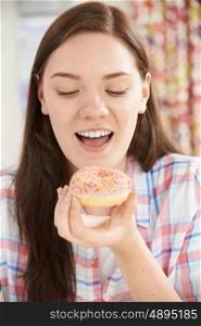 Smiling Teenage Girl On Eating Donut