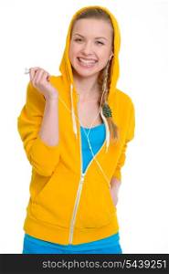 Smiling teenager girl listening music in earphones