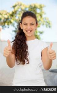Smiling teenager girl saying ok outside