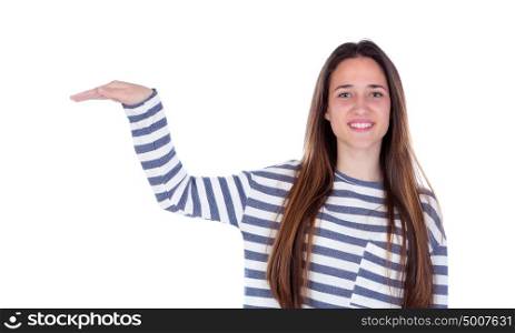 Smiling teenager girl showing something with her hand isolated on a white background