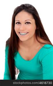 Smiling teenager girl with brackets isolated on a white background