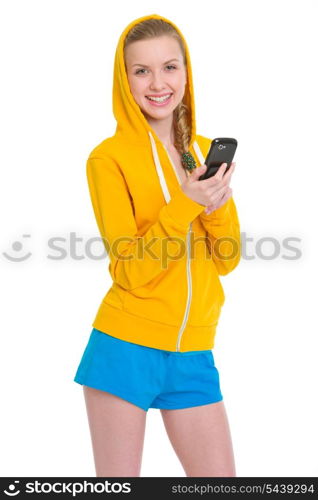 Smiling teenager girl writing sms