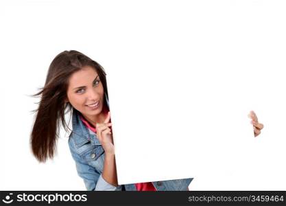 Smiling teenager showing whiteboard