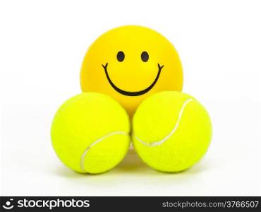 smiling tennis ball and two normal balls