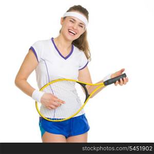 Smiling tennis player playing on racket as on guitar