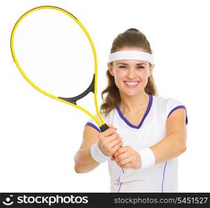 Smiling tennis player showing racket