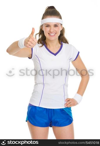Smiling tennis player showing thumbs up