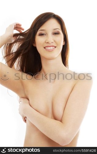 smiling topless brunette with long hair over white