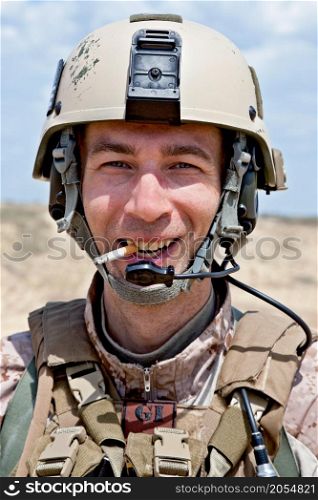 smiling US soldier smoking a cigarette