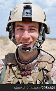smiling US soldier smoking a cigarette