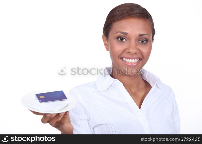 Smiling waitress with the bill and a credit card