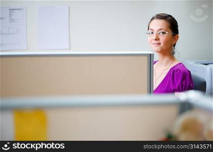 Smiling woman at office in casual clothes
