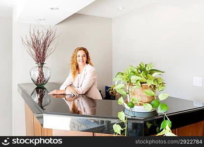 Smiling woman at office reception