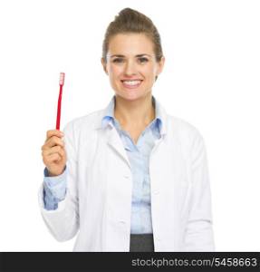 Smiling woman dentist showing toothbrush