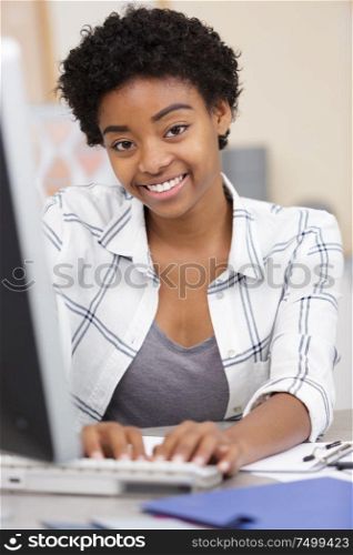 smiling woman having video conference via laptop computer