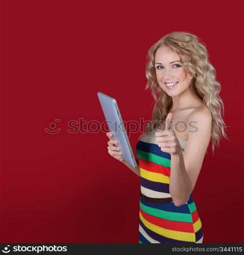 Smiling woman holding electronic tablet