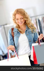 Smiling woman holding shopping bags