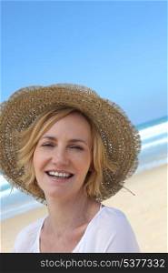Smiling woman in a straw hat