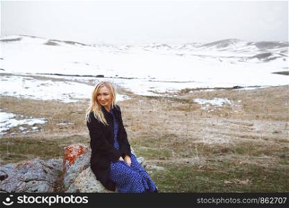 Smiling woman in the winter landscape