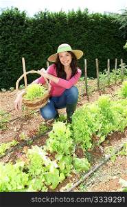 Smiling woman in vegetable garden