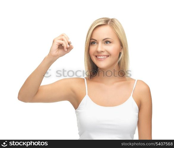 smiling woman in white shirt writing in the air