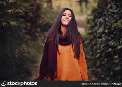 Smiling woman looking at the camera in the field