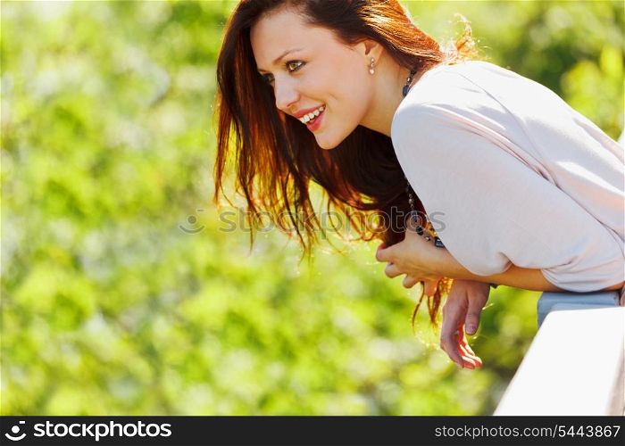 Smiling woman looking on copyspace on spring day