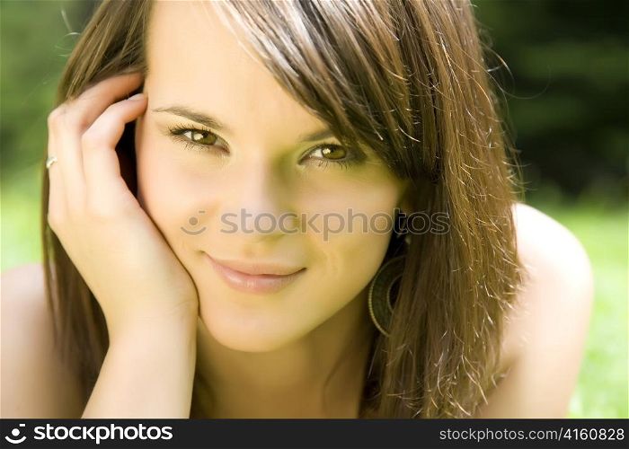 Smiling Woman On The Nature Background