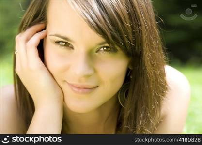 Smiling Woman On The Nature Background
