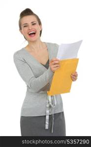 Smiling woman reading letter