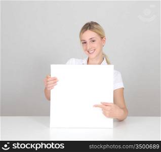 Smiling woman showing message board