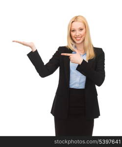 smiling woman showing something imaginary on her hand