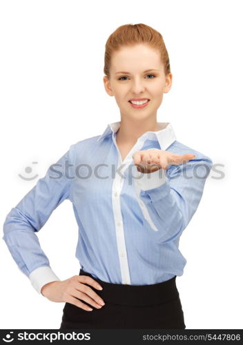 smiling woman showing something on the palm of her hand