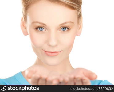 smiling woman showing something on the palms of her hands