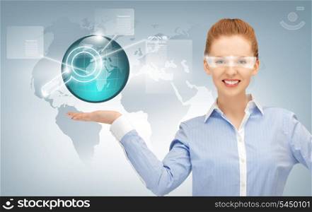 smiling woman showing virtual earth globe on the palm of her hand