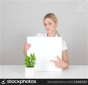 Smiling woman showing whiteboard