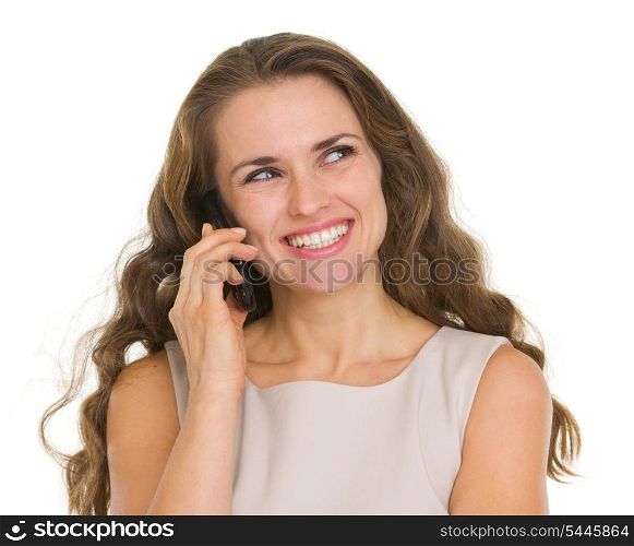 Smiling woman talking mobile phone and looking on copy space