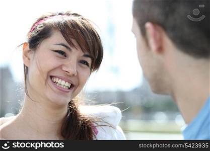 Smiling woman talking to a man