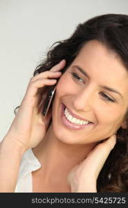 Smiling woman using a cellphone