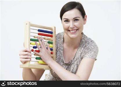 Smiling Woman Using Abacus