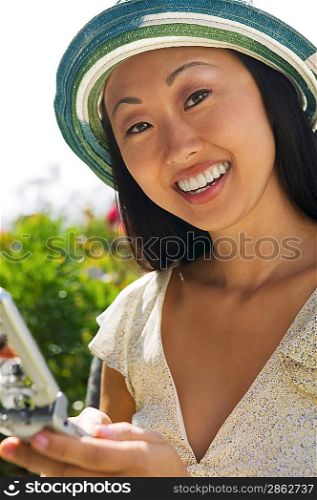 Smiling Woman Using Cell Phone