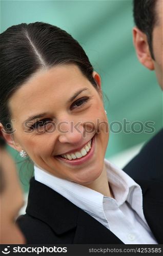 Smiling woman wearing suit
