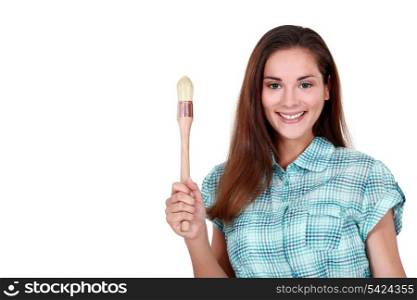 Smiling woman with a paintbrush