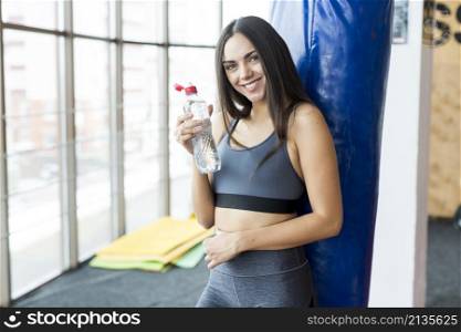 smiling woman with bottle water