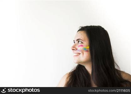 smiling woman with colours face