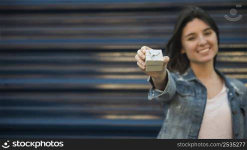 smiling woman with present box