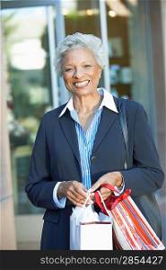 Smiling Woman with Shopping Bags
