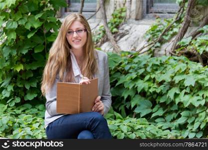 Smiling woman writes in her journal