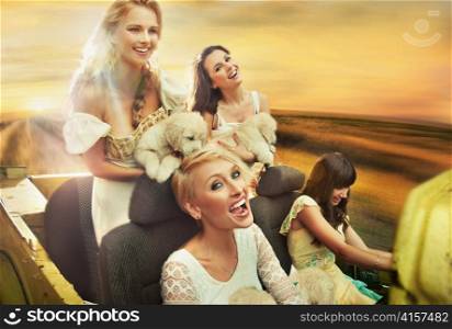 Smiling women driving a car